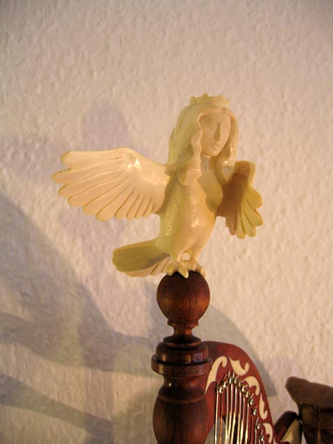 Напольные часы (grandfather clock). Авторская работа Александра Бабеля. Райская птица Сирин (кость бивня мамонта).